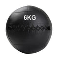 Black wall ball with '9KG' marking on a white background