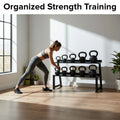 Woman exercising with kettlebells in a home gym setting