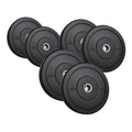 Set of black weight plates with labeled weights on a white background