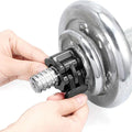 Hand adjusting a metal shower head on a white background