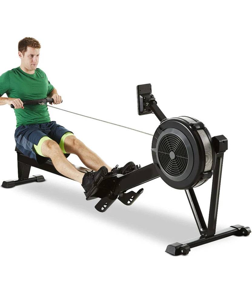 Black rowing machine on a white background